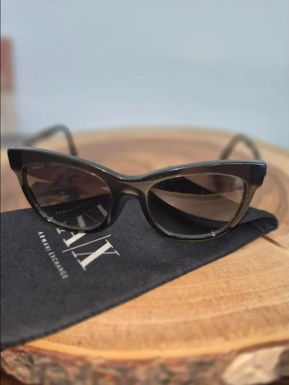 Giorgio Armani with A/X sunglass bag